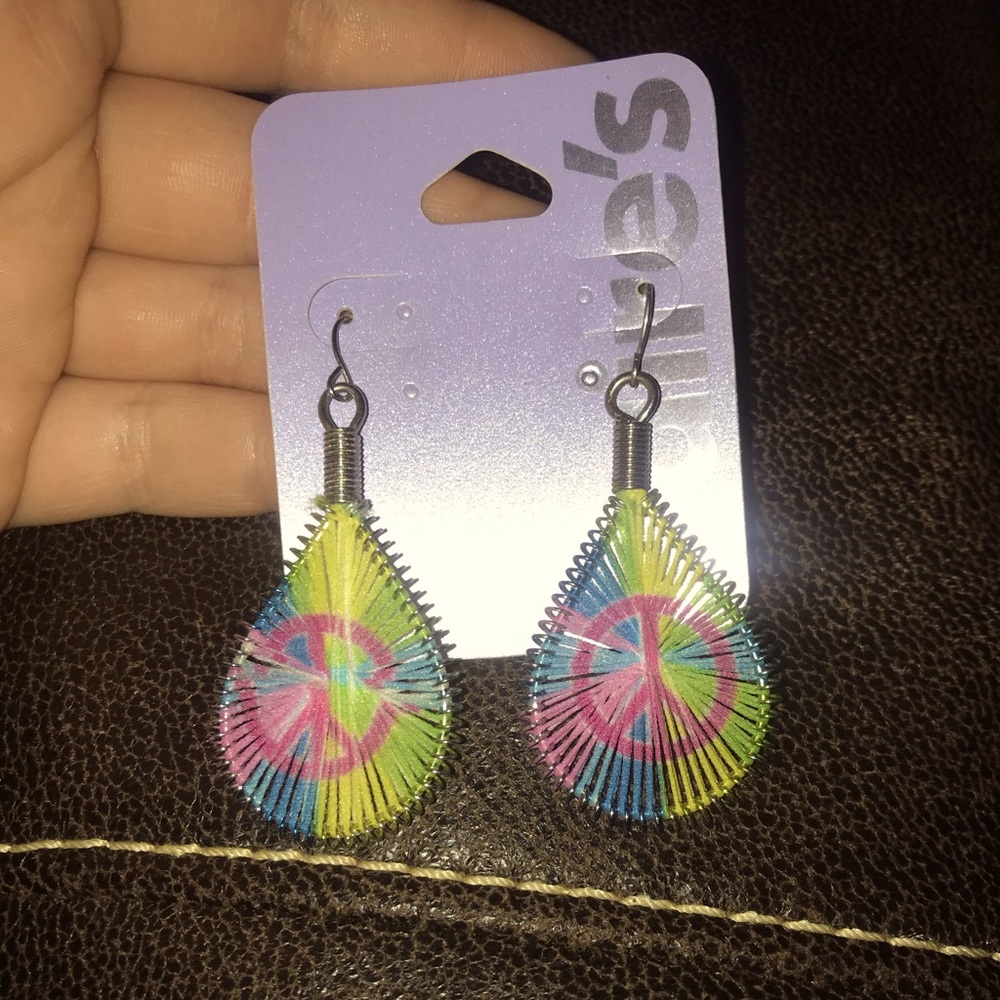 Claire’s peace earrings